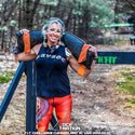 Kristine wearing the high waist leggings Polyester/Spandex Blend Color—Digicamo orange with Fight2Thrive quote and Empower Fist